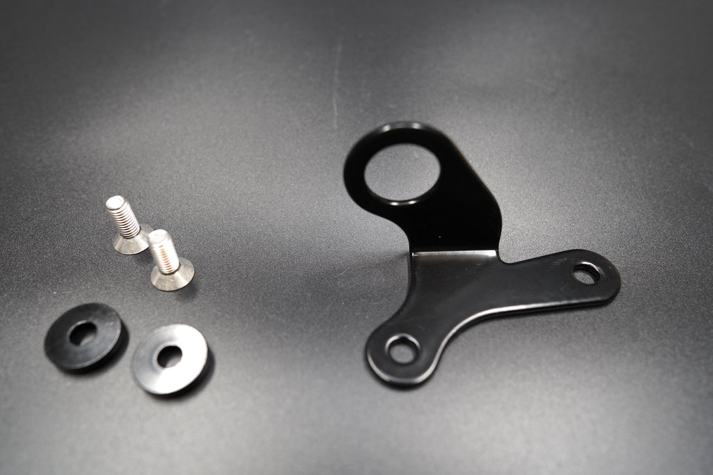 Black metal bracket close-up showing mounting hole design