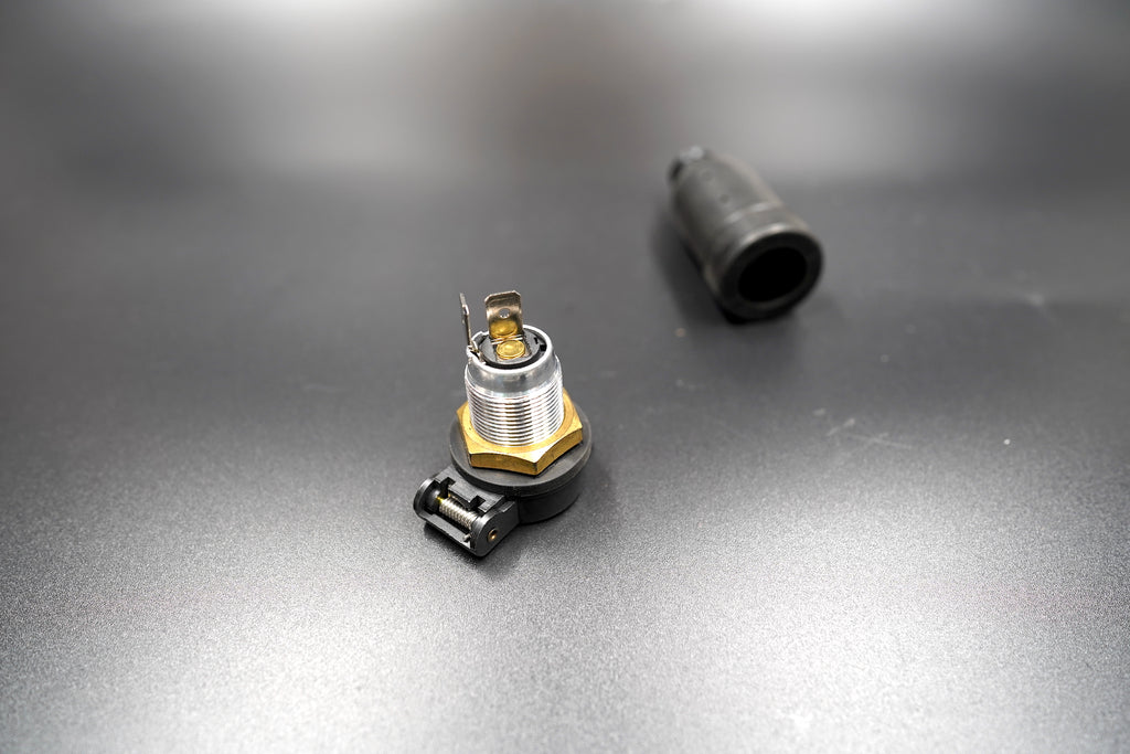 Outlet and bracket separated to show installation parts