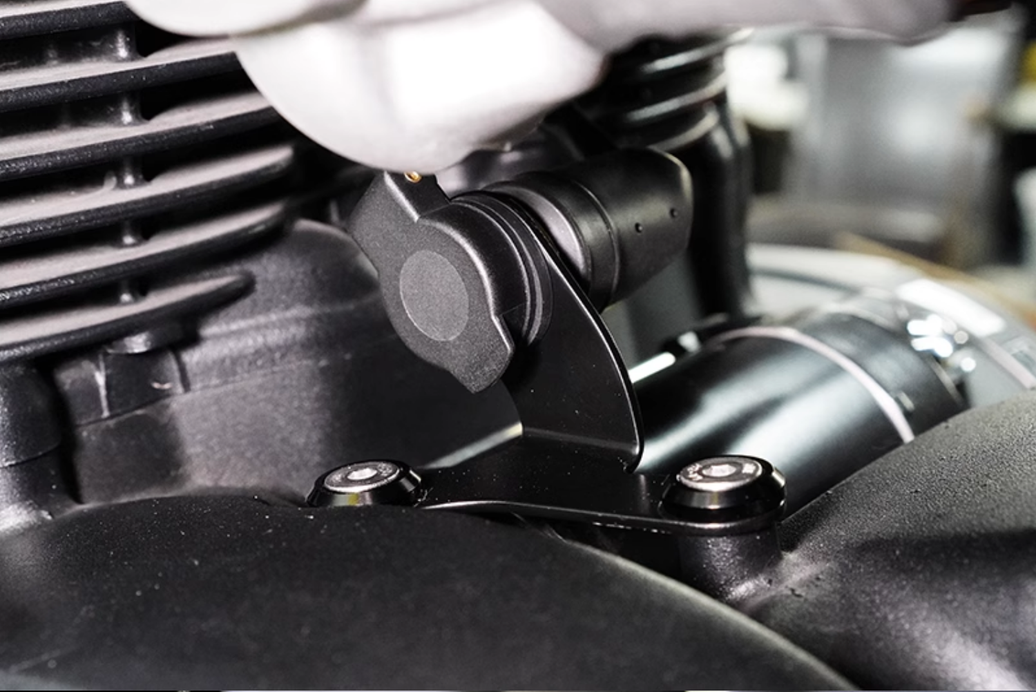 Installed view of 12V outlet and bracket on Triumph Speedmaster 