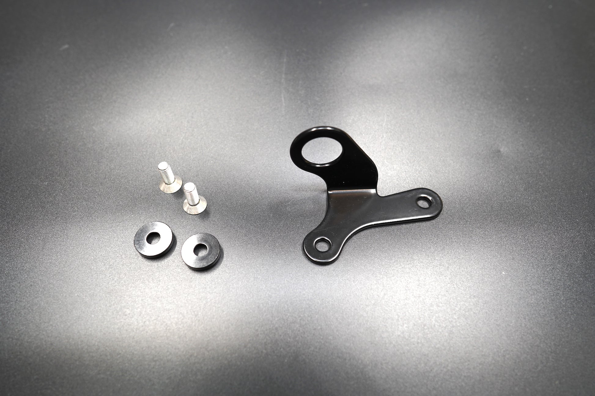 Components of 12V power outlet including screws, bracket, and washers 