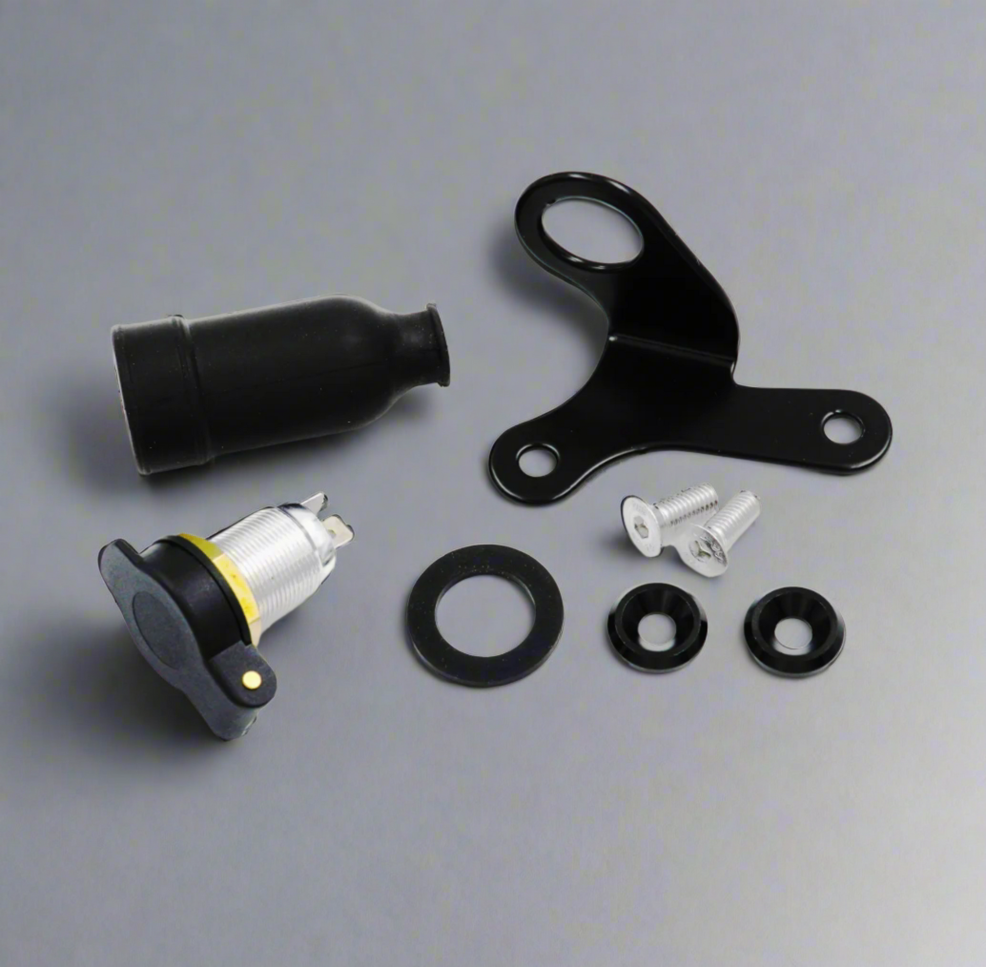 Components of 12V power outlet including screws, bracket, and washers