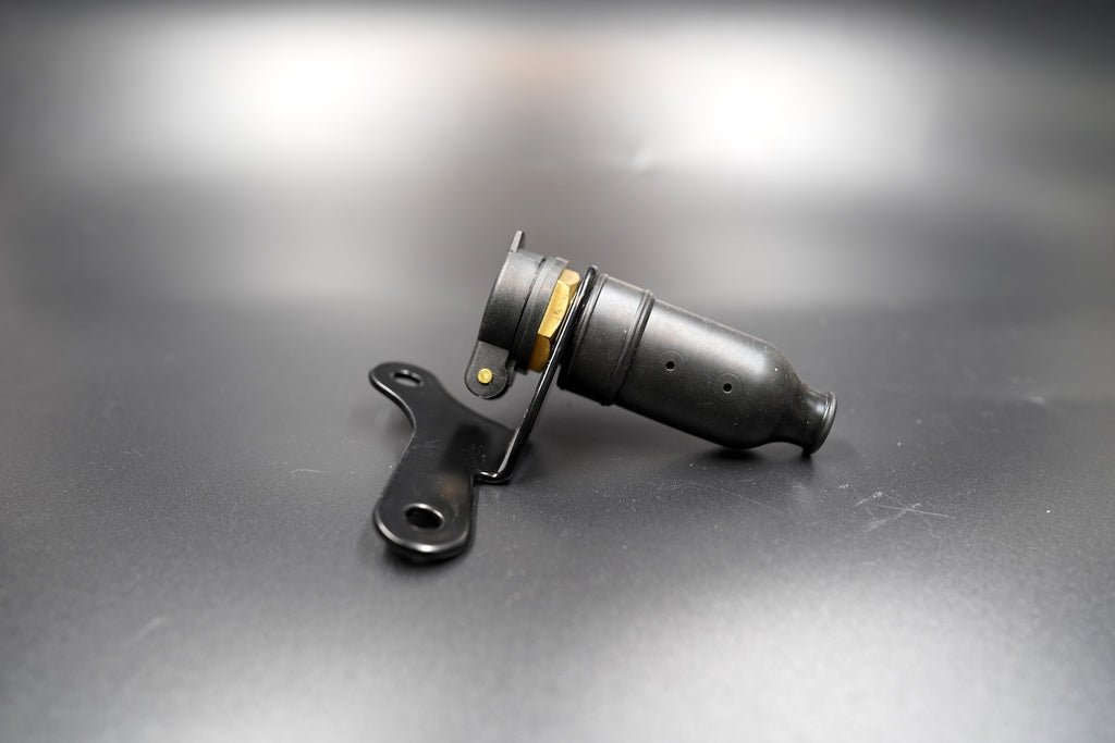 Side view of assembled 12V socket on matte surface 