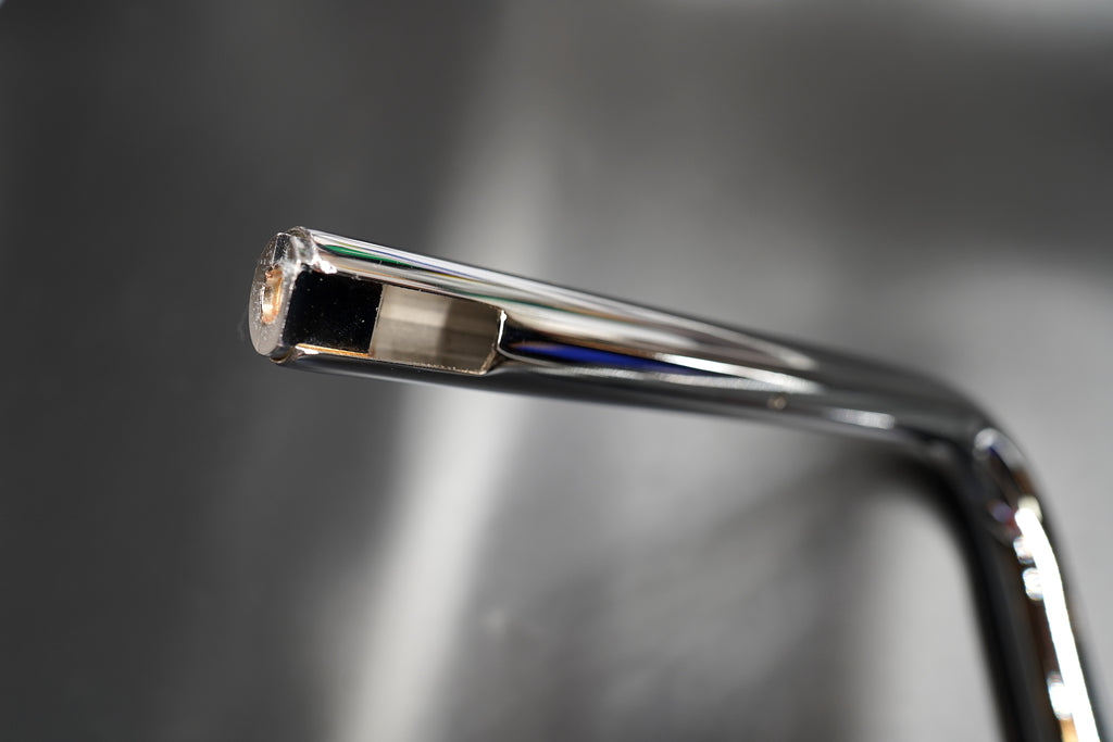 End of handlebar showing internal machining for bar-end accessories