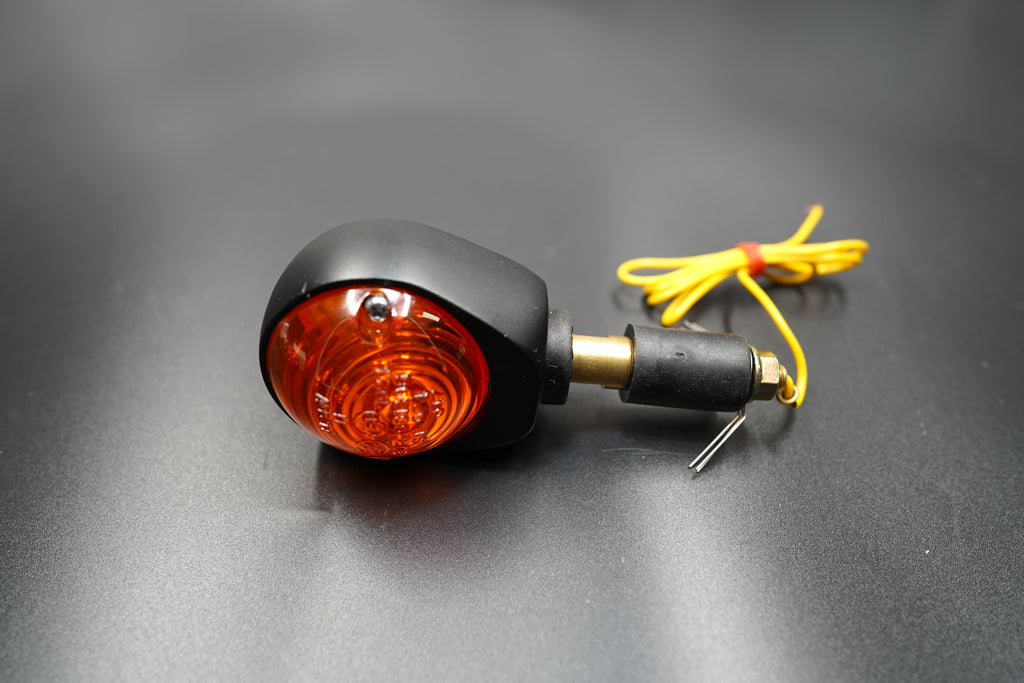 Bar End Turn Signal – close-up showing wiring detail and brass mount