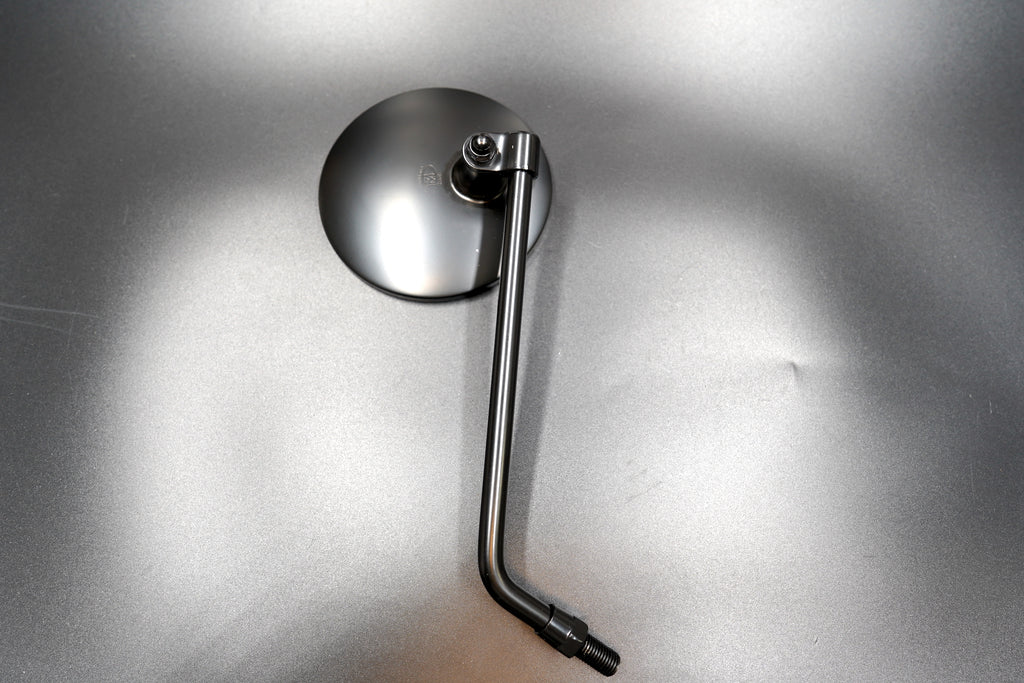 Matte black round motorcycle mirror flat lay

