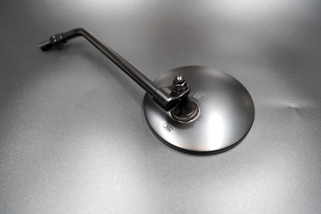 Close-up of matte black mirror glass and edge

