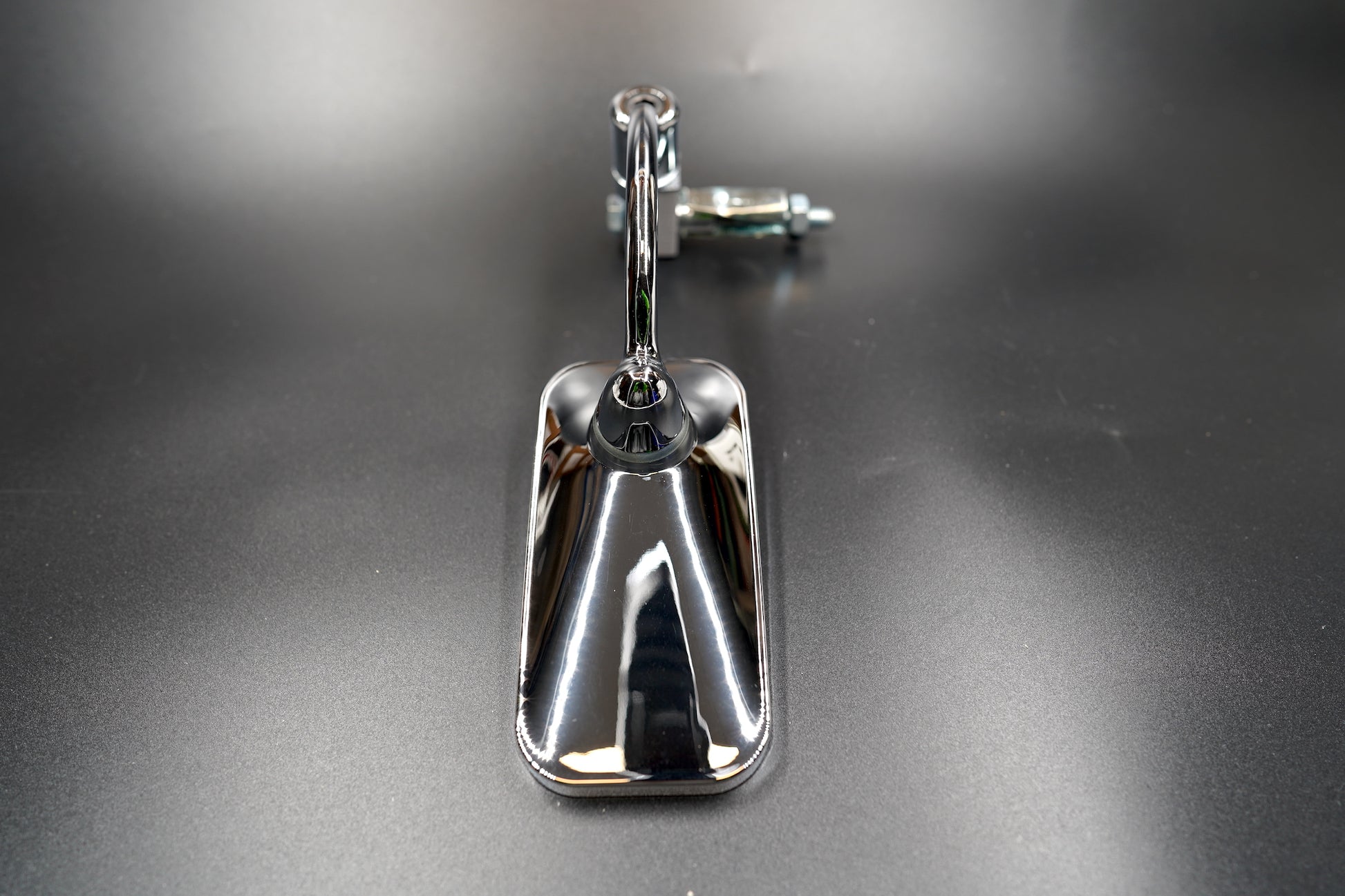 Chrome rectangular motorcycle mirror showing front detail