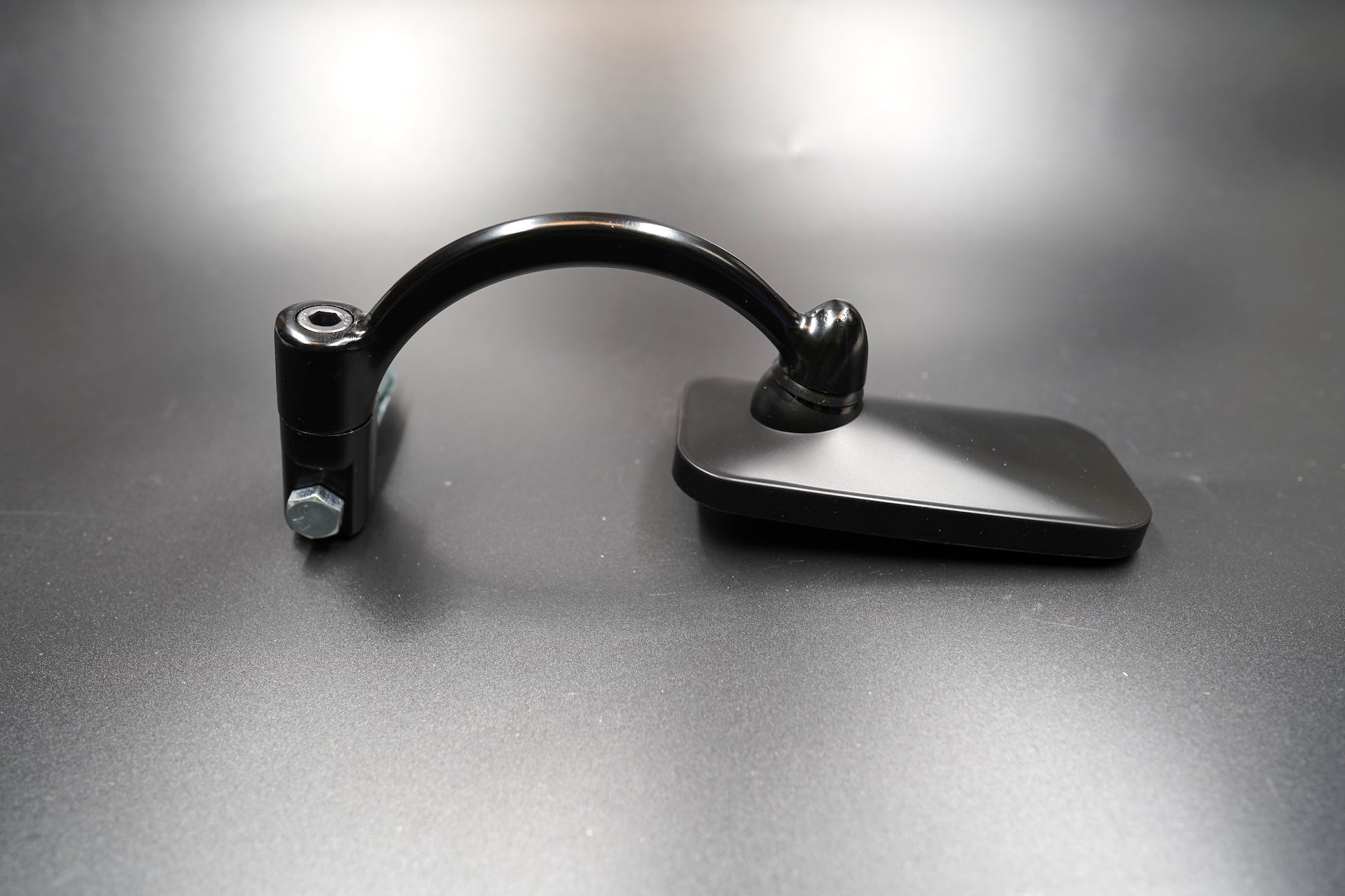 Matte black rectangular motorcycle mirror with mounting bolt