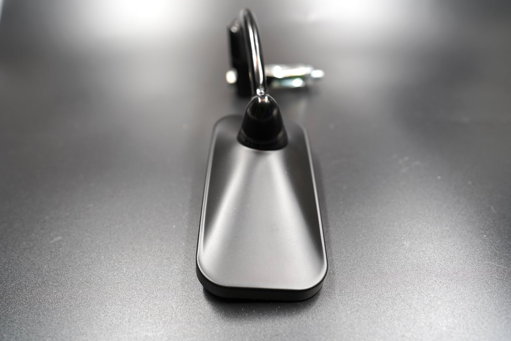 Close-up detail of the hinge joint and mirror head — corrosion-proof finish, engineered for endurance.