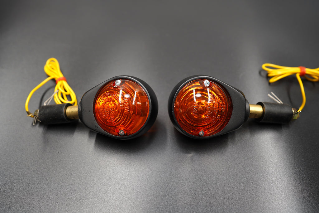 Angled front shot highlighting amber glass glow and compact profile for minimalist builds.
