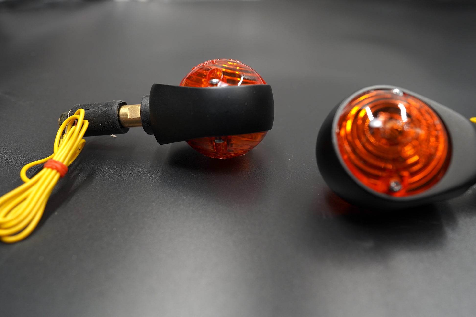 Rear view showing matte black casing, wire exits, and halogen bulb mount.