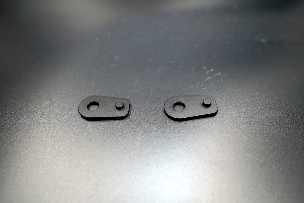 Side view of BMW R NineT aluminum spacers showing mounting holes