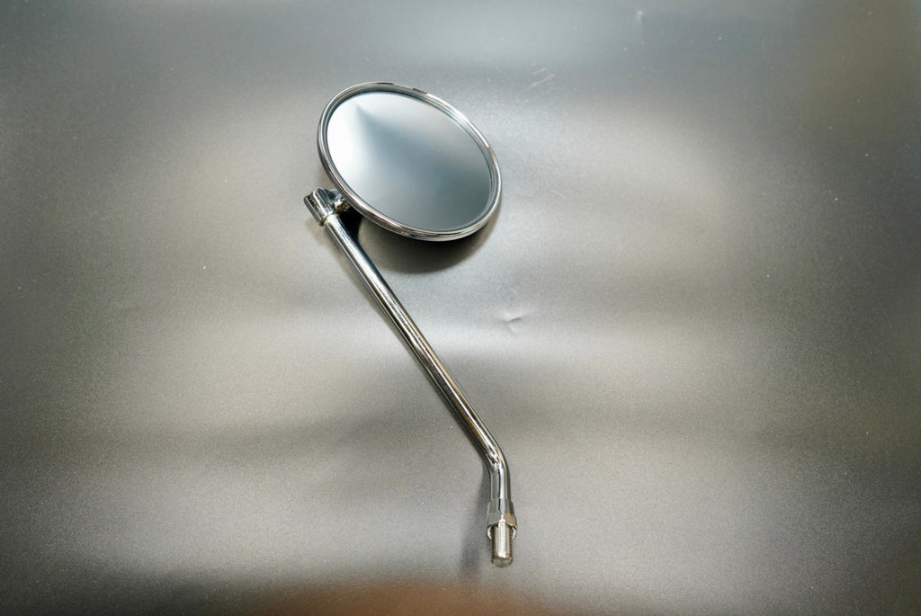 Front angled view of classic round motorcycle mirror in chrome finish — minimalist, vintage-inspired design.