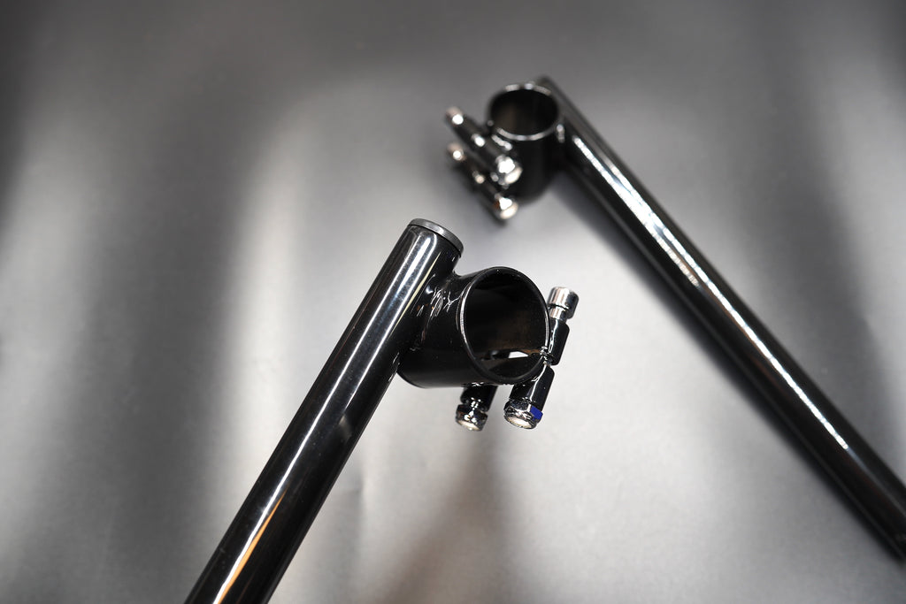 Wide overview of both bars positioned in riding stance for display.