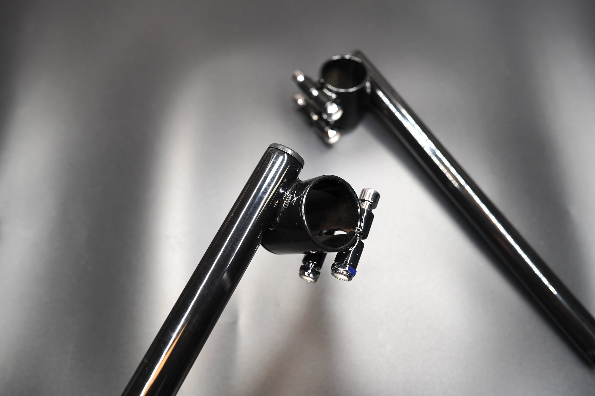 Wide overview of both bars positioned in riding stance for display.