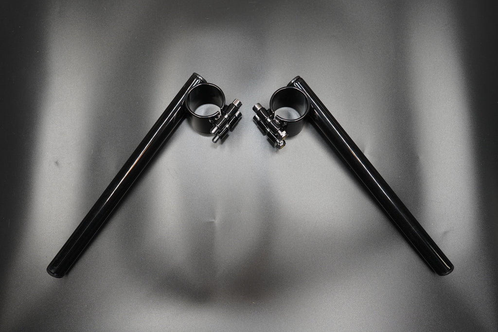 Top view showing symmetrical clip-on handlebar layout with fork clamps attached.