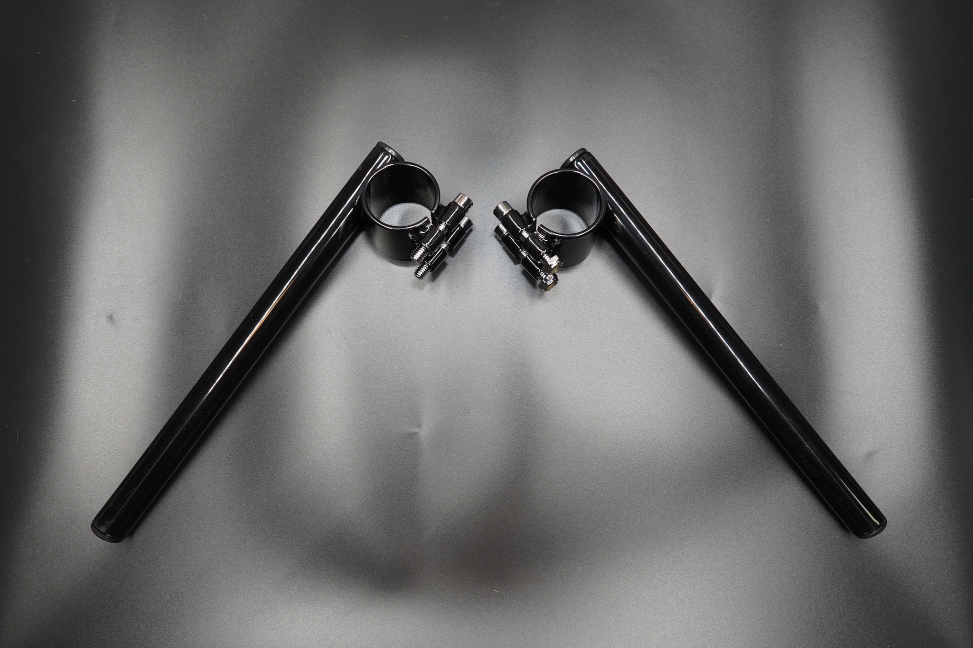 Top view showing symmetrical clip-on handlebar layout with fork clamps attached.