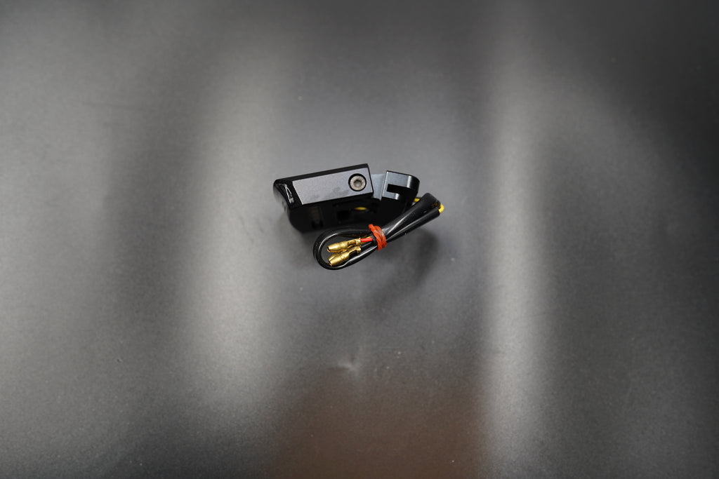 Close-up of adjustable clamp mount showing clean fit for plate installation.