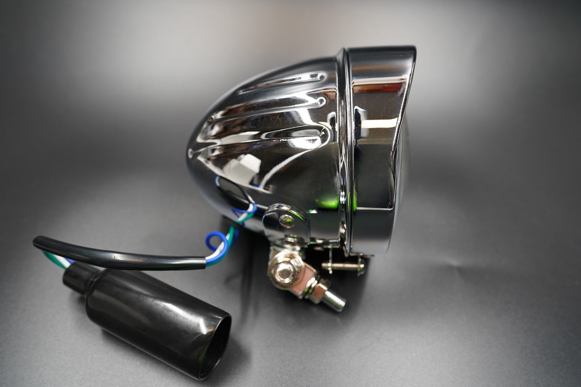 Bottom mount detail showing universal fit bracket and cable connection.