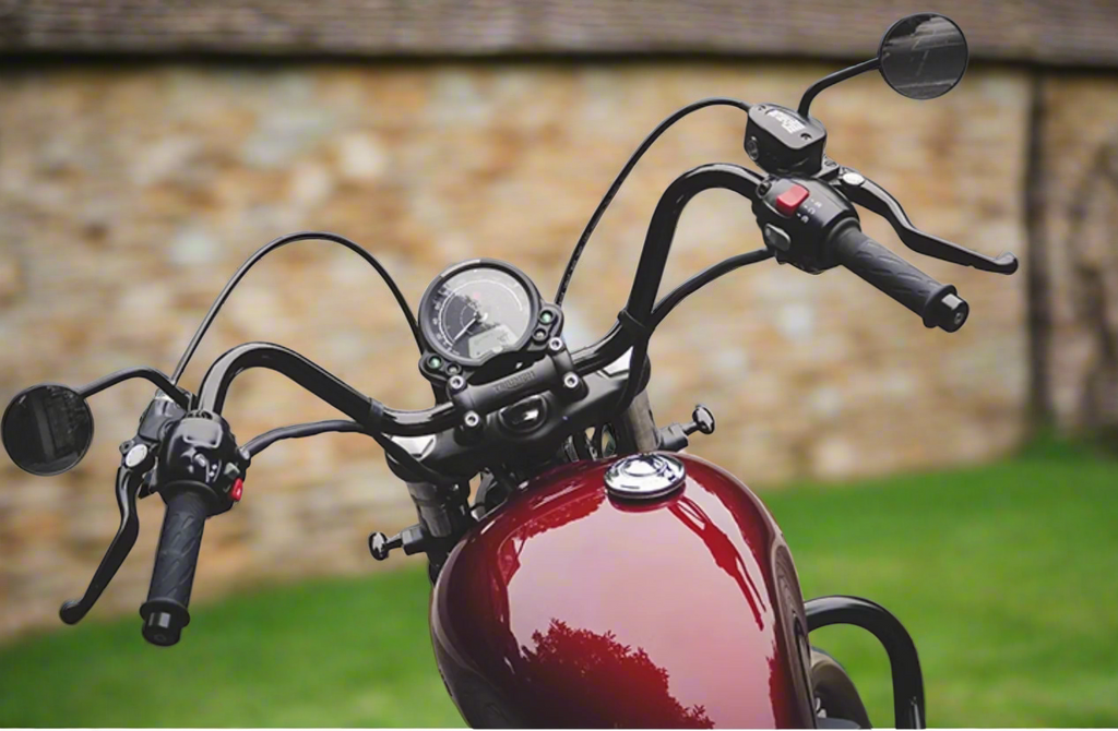 Triumph motorcycle with Flow Handlebar parked on stone street 