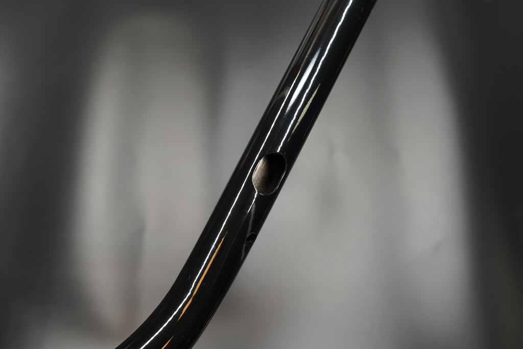 Side profile close-up showing smooth bend and gloss surface 