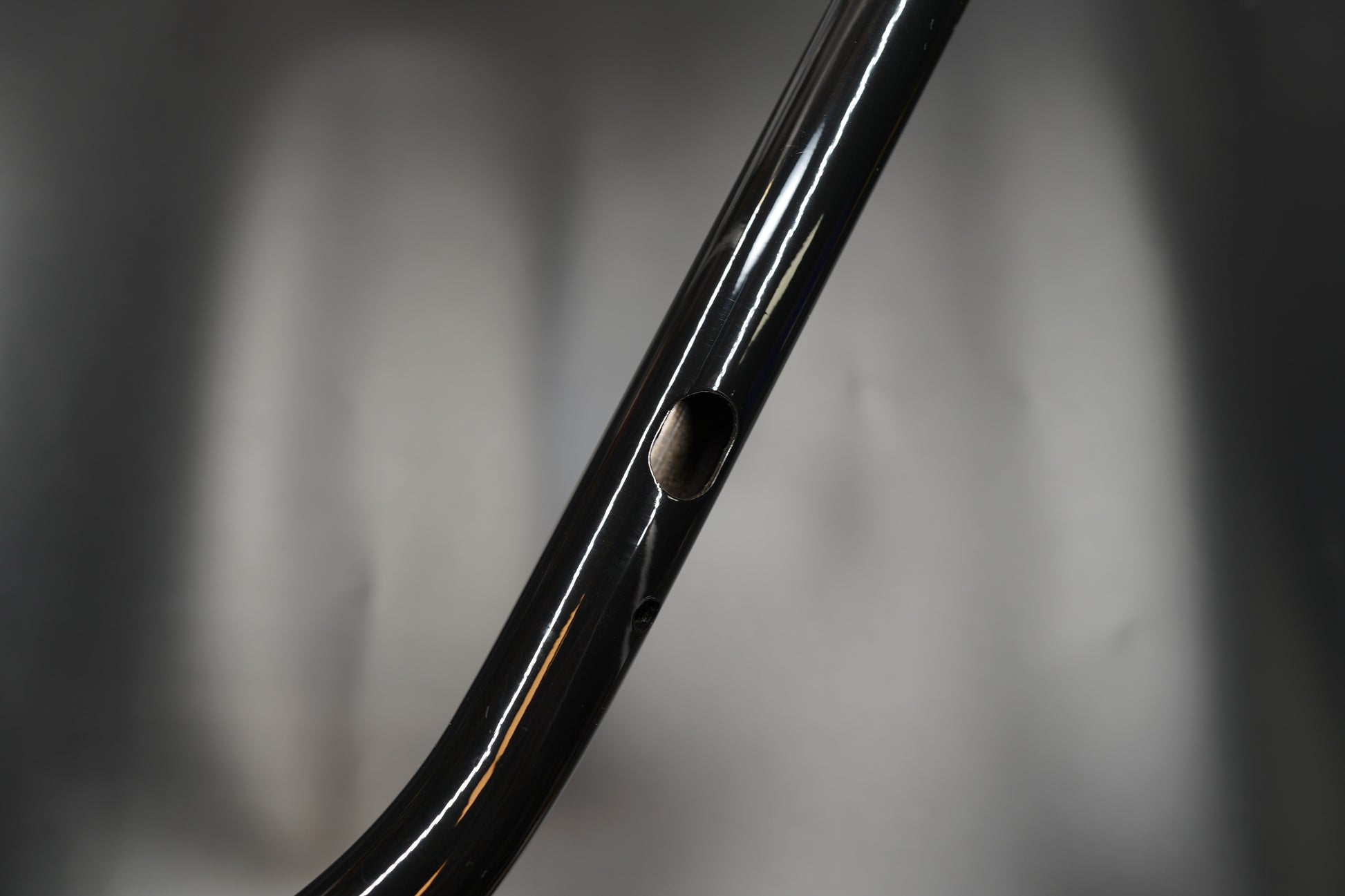 Side profile close-up showing smooth bend and gloss surface 