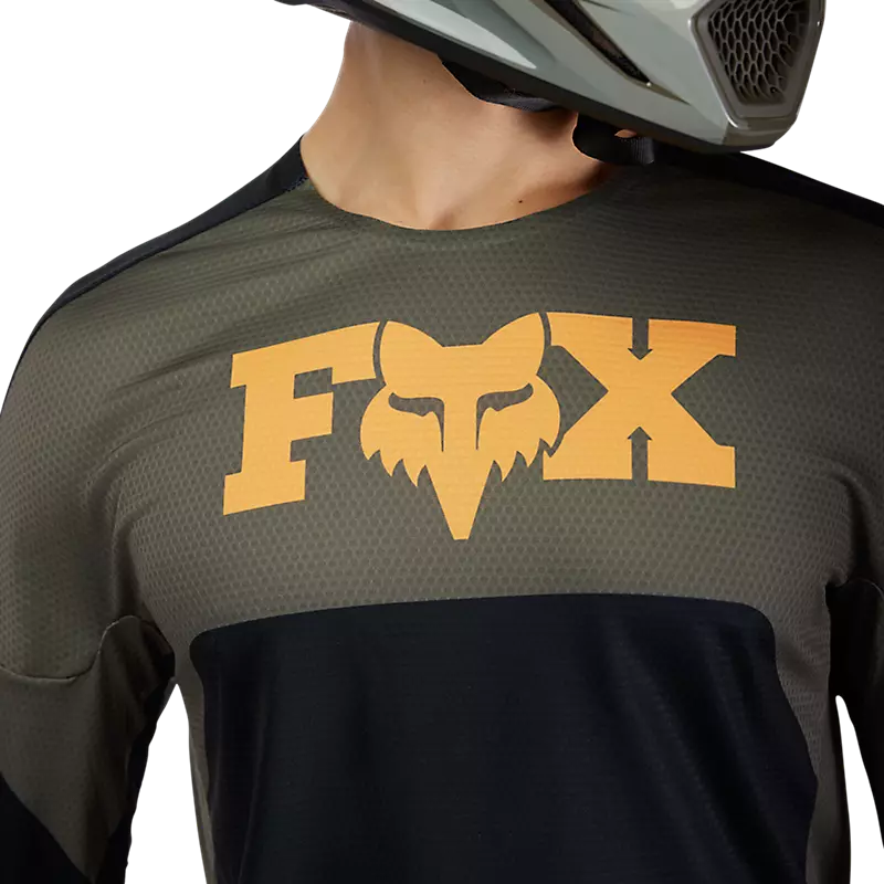 Rider wearing Fox 360 Fade Jersey — ergonomic RAP sleeves for natural riding movement.