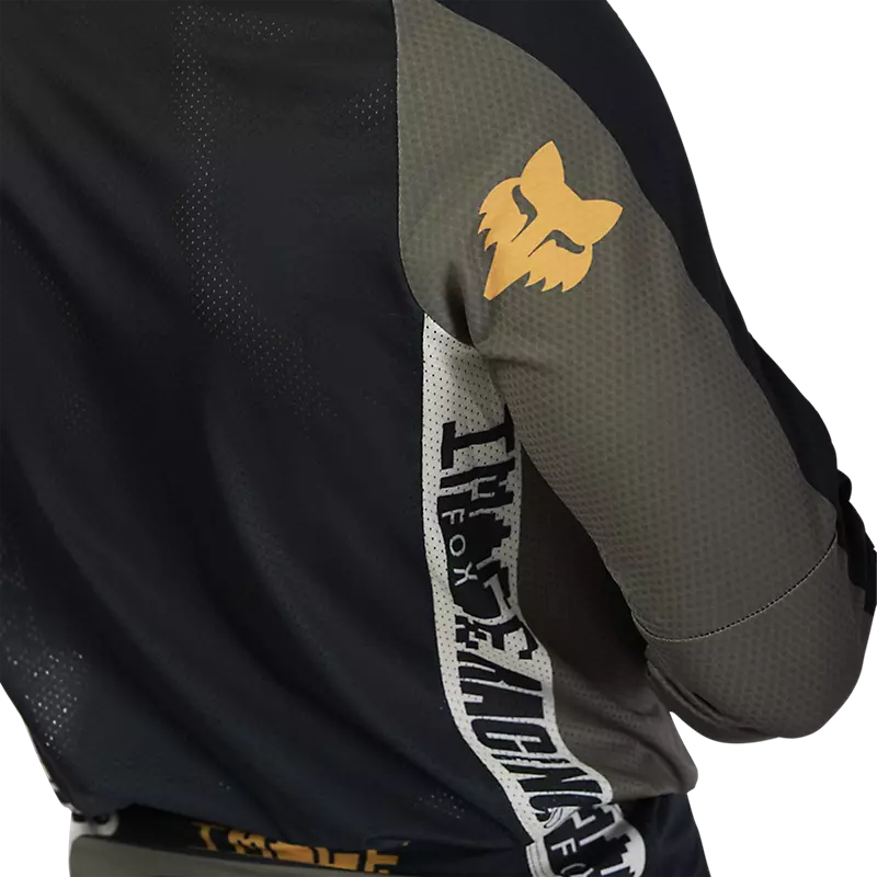 Close-up of Fox 360 Fade Jersey logo and texture — fade color blocking and premium stitching detail.