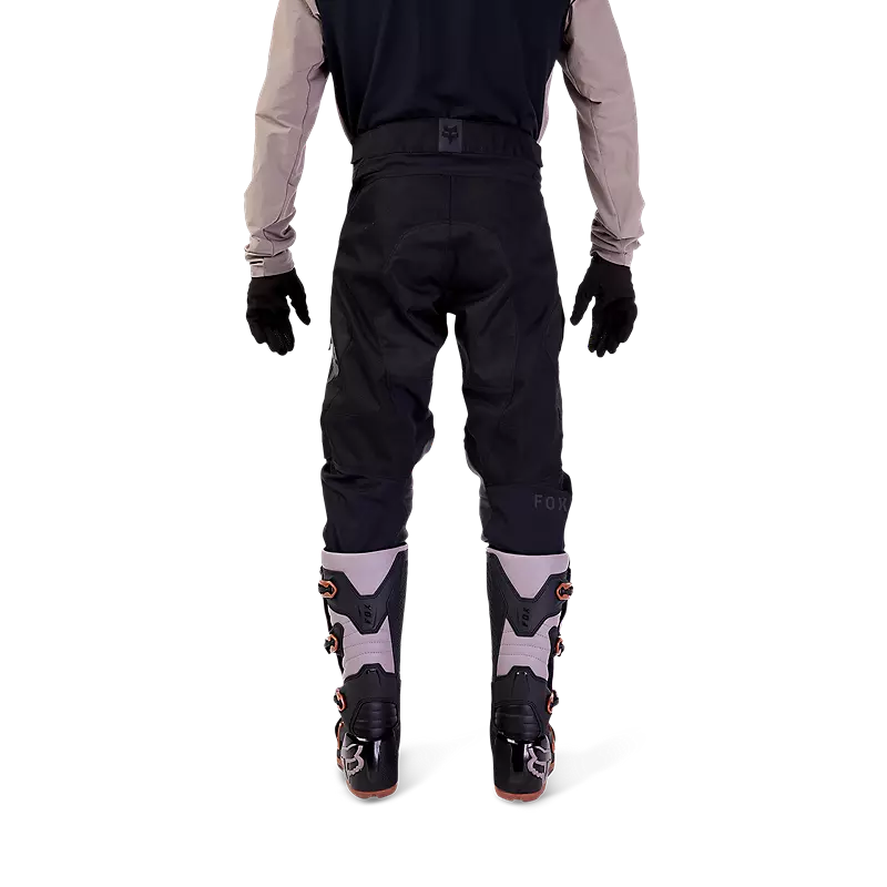 Back view of rider wearing Fox Defend Offroad Pants — articulated fit and reinforced seat area for off-road movement.