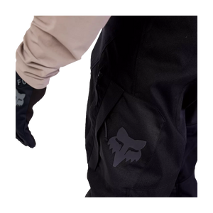 Side view of Fox Defend Offroad Pants showing full-grain leather inner knee for grip and heat protection.