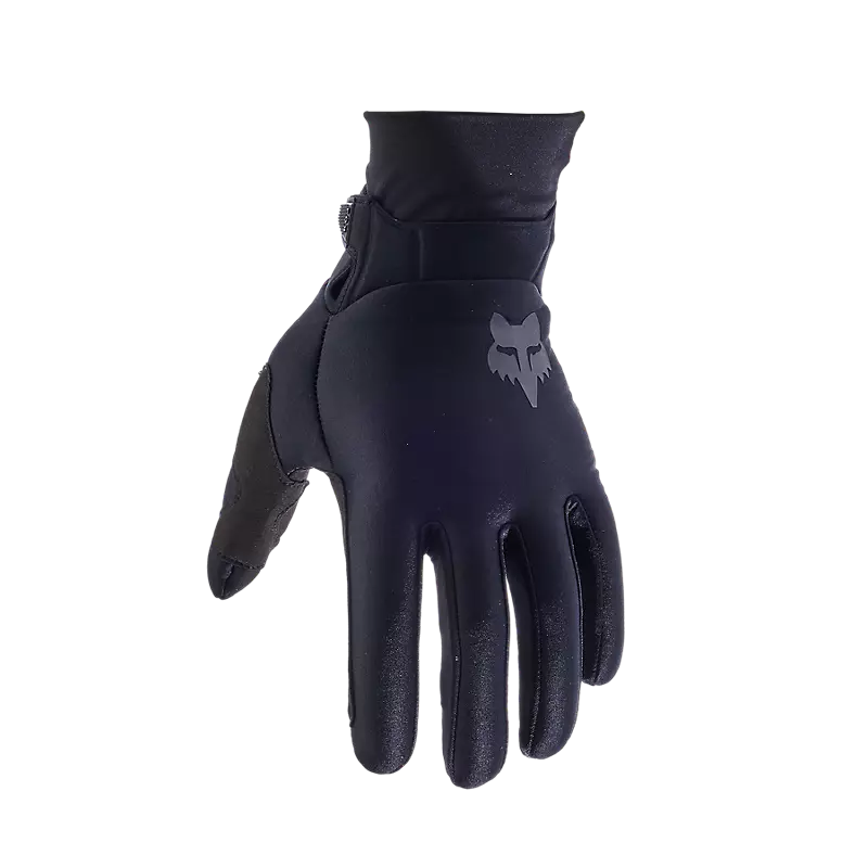 Angled view of Fox Defend Thermo Gloves in black — compression neoprene cuff and minimal bulk design for cold-weather riding.