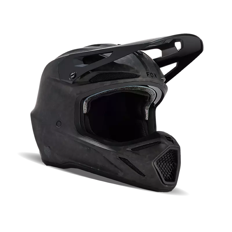 Side view of Fox V3 RS Carbon Helmet in black — 4K carbon fiber shell for lightweight motocross performance.