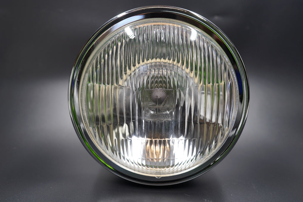 Close-up showing brushed metal trim and clear lens surface detail.