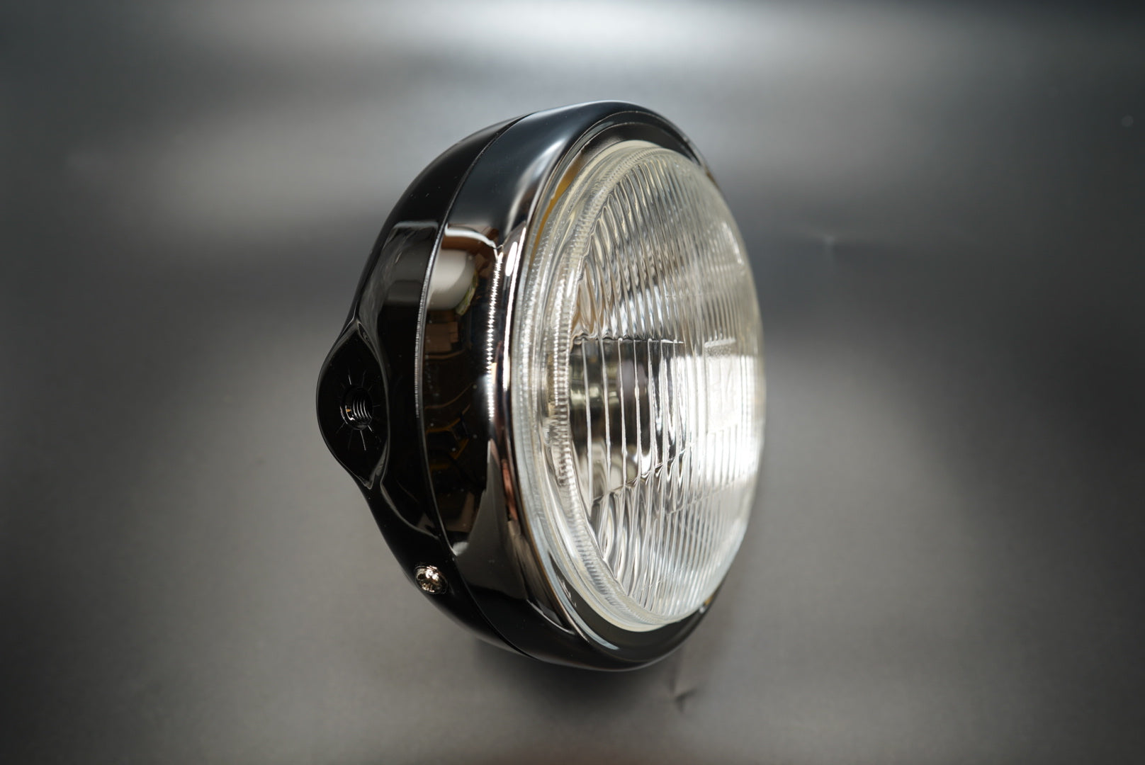 Right side angle showing smooth chrome housing curvature