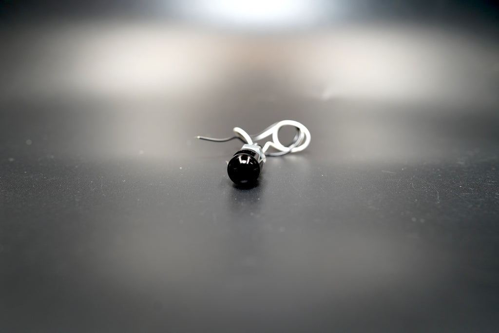 Side perspective showing wiring angle and aluminum housing texture.