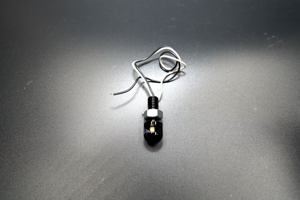 Top-down view showing the compact cylindrical shape and smooth black anodized finish.