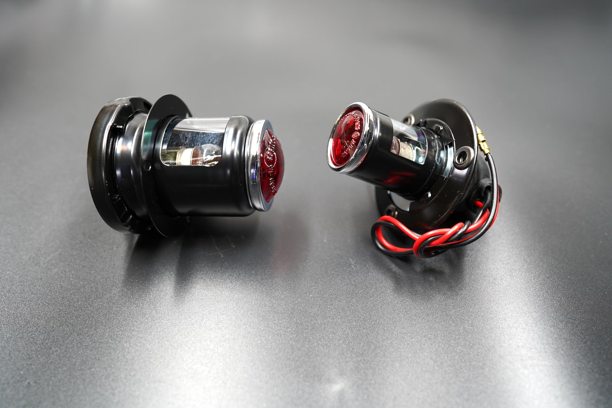 Close-up of polished alloy edge and red lens detail — precision-built and durable.