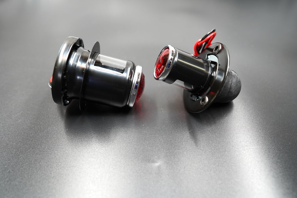 Full product set with both lights and cables — complete view of MT110-style rear light system.