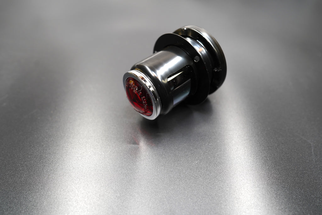 Side profile showing compact metal housing — designed for fenders and loop tails.
