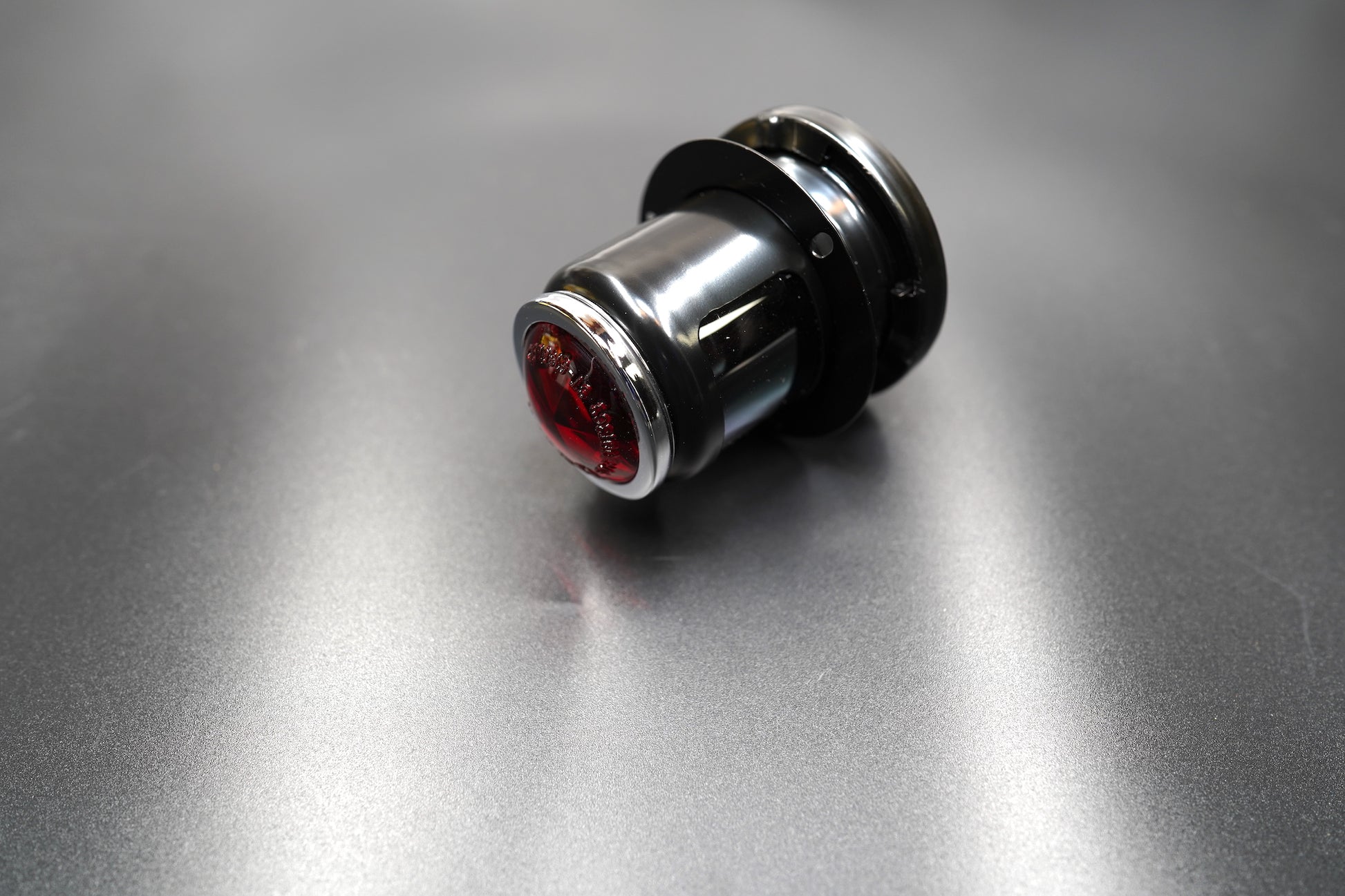 Side profile showing compact metal housing — designed for fenders and loop tails.
