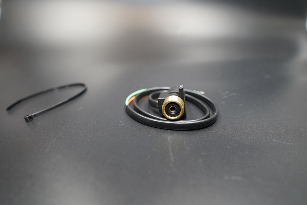 Full flat lay of converter and cable arranged neatly on silver-grey surface.