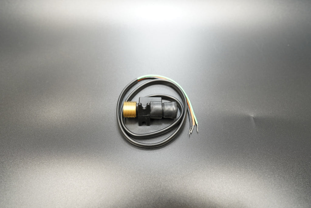 12mm motorcycle mechanical-to-electronic speedometer converter, front angle view on matte background.