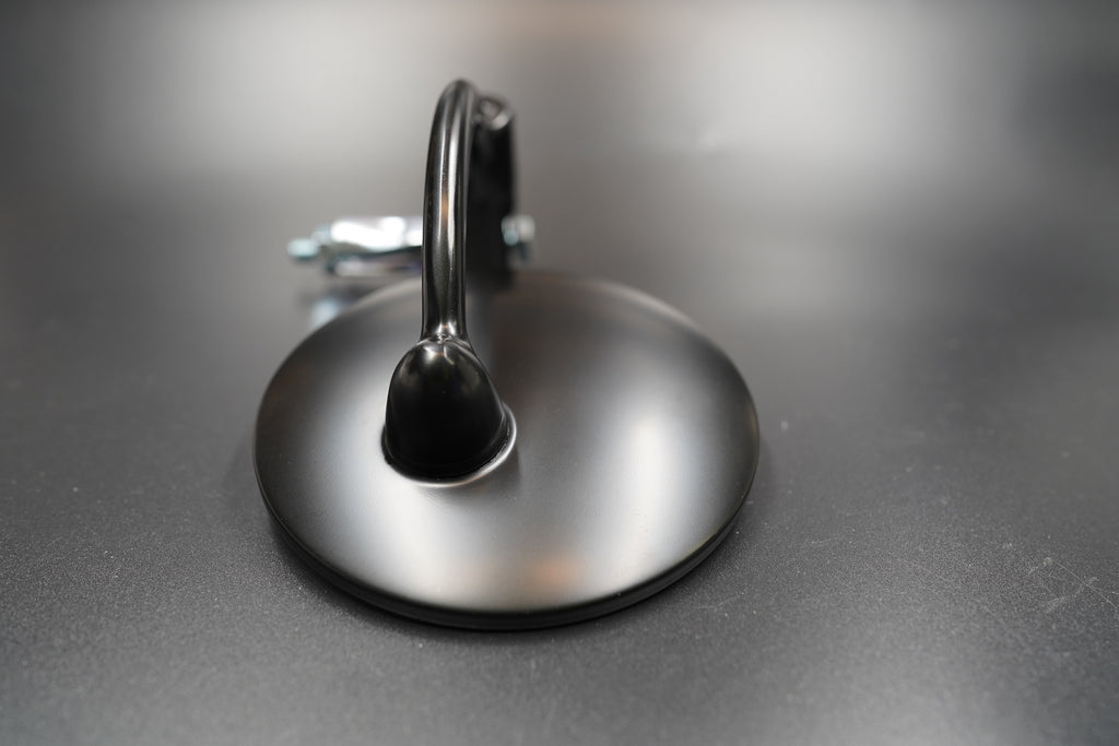 Round mirror variant with smooth edges and reflective clarity.