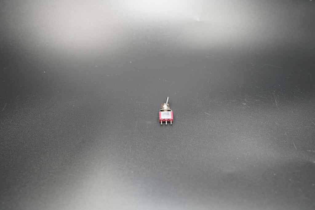 Close-up of toggle handle and metal nut