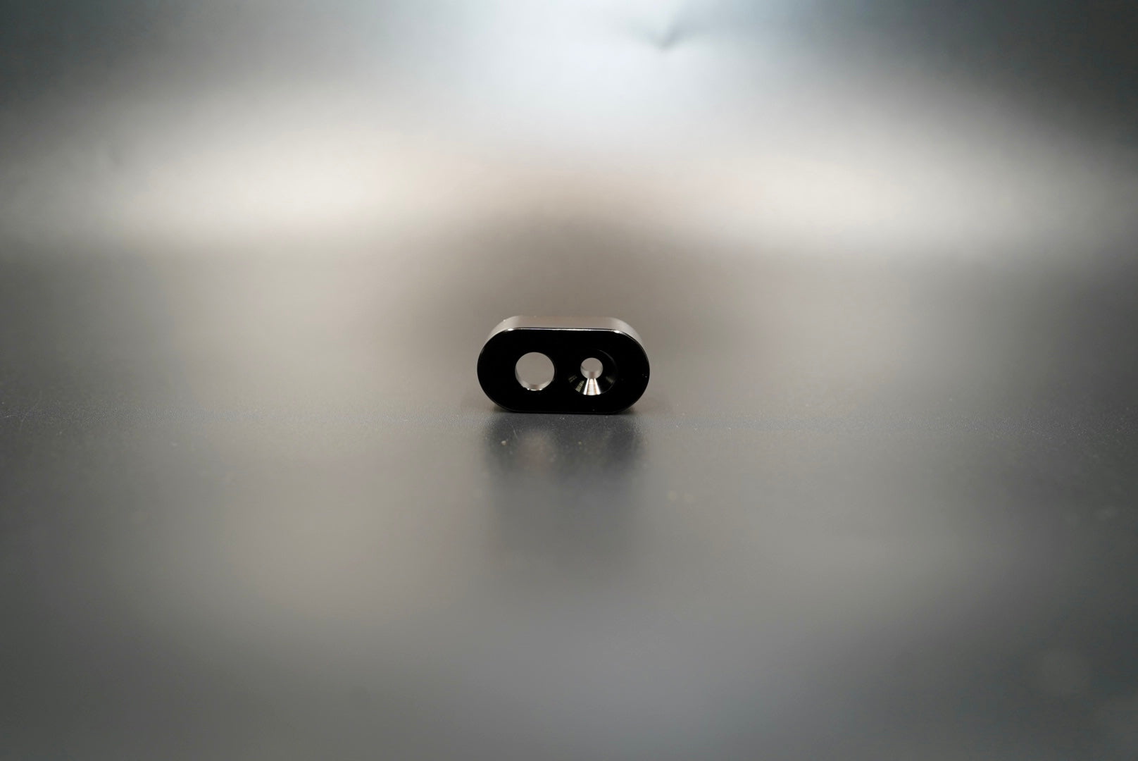  Front view of matte black single-hole handlebar switch housing