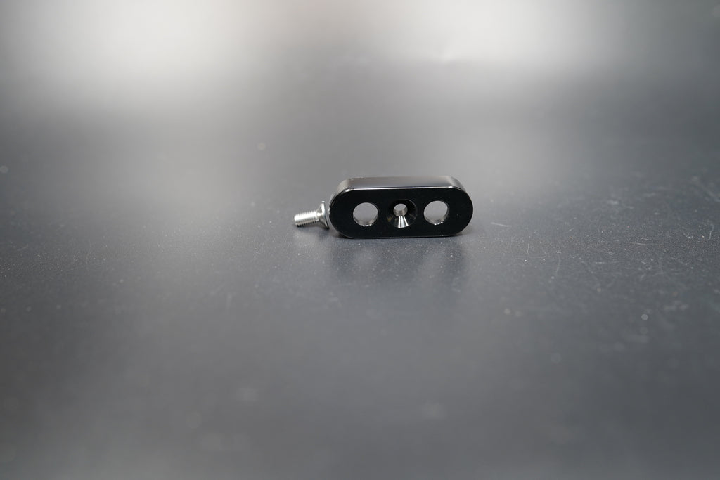 Side profile of black switch mount showing hole alignment 