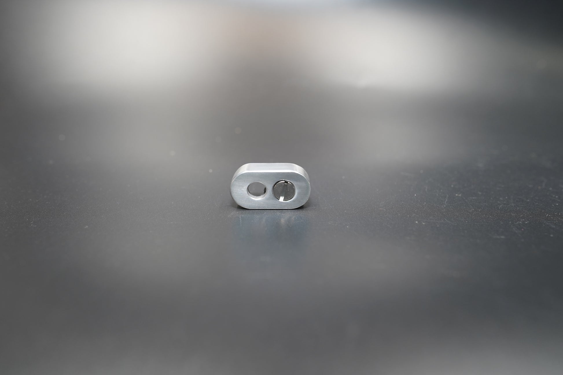 Angled detail of silver handlebar mount showing clean machining lines