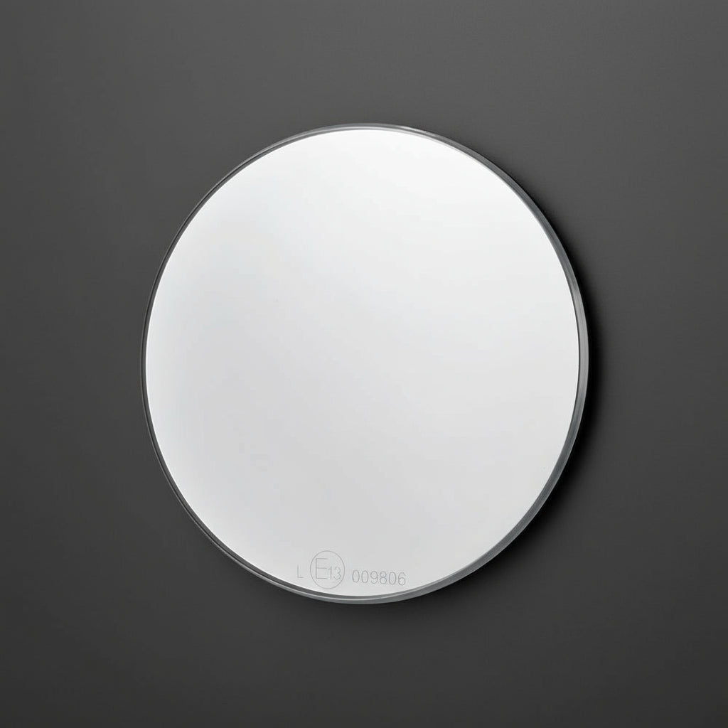 Close-up of mo.view classic mirror surface — polished optical glass showing refined machining and clean reflection.