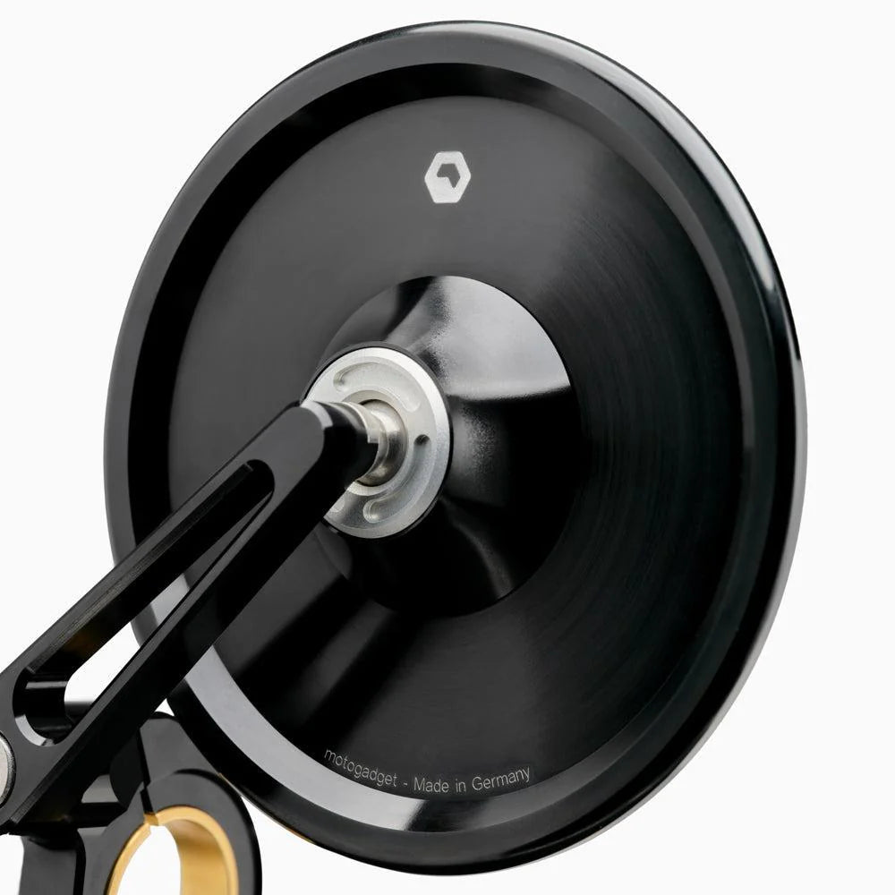 Motogadget mo.view classic 60 flip mounted on motorcycle handlebar — adjustable above or below the bar for versatile fit.