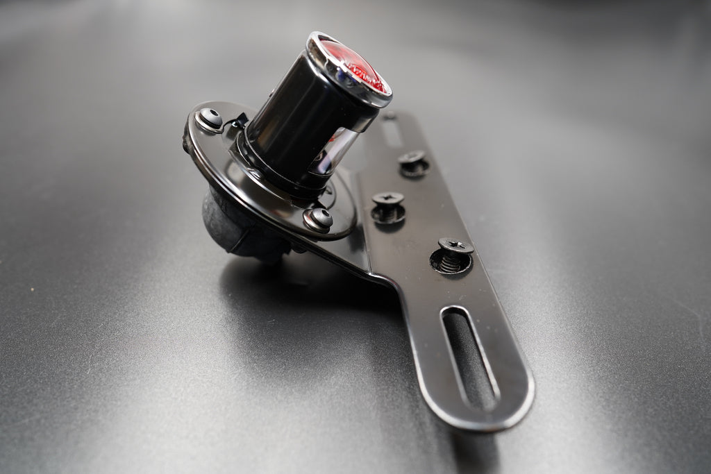 Rear housing view showing matte black coating and bolt mount area.